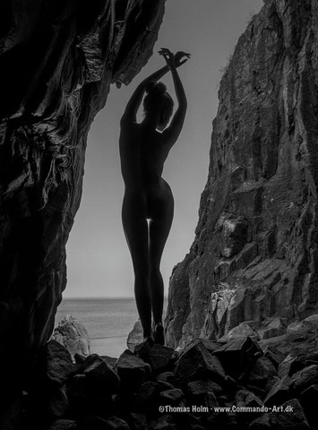 Model Mette Munkø Silhouette in a cave near a mountainTH2013-1128. Foto/Photo: Thomas Holm